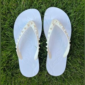 Christian Louboutin spike flip flops